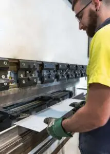 Worker operating a machine